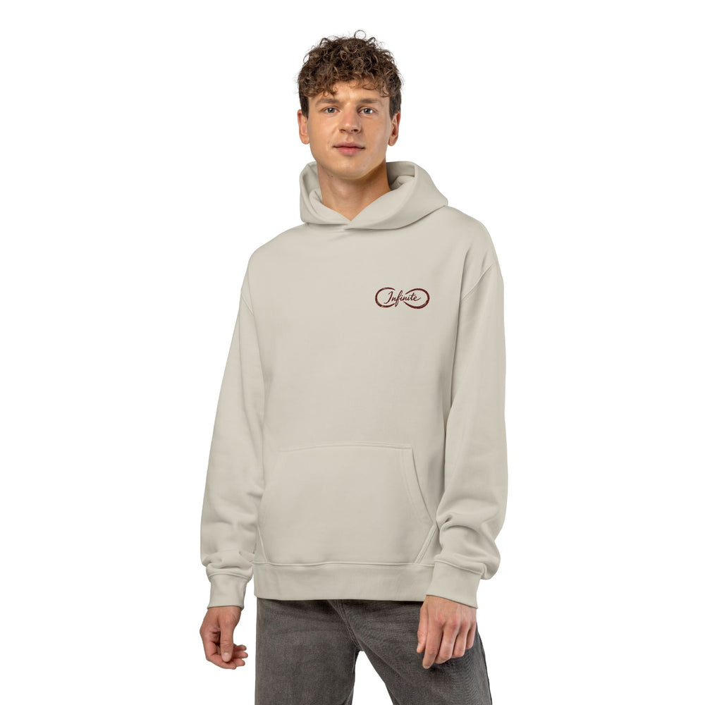 Unisex relaxed fit hoodie with soft cotton-poly fleece, drop shoulders, kangaroo pocket, and ribbed cuffs for streetwear style and comfort
