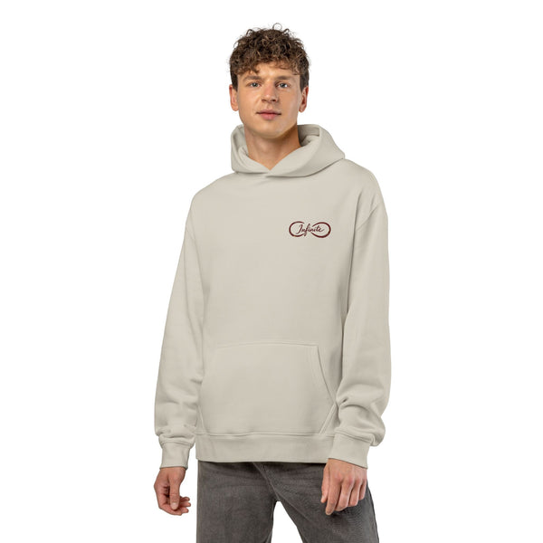 Unisex relaxed fit hoodie with soft cotton-poly fleece, drop shoulders, kangaroo pocket, and ribbed cuffs for streetwear style and comfort
